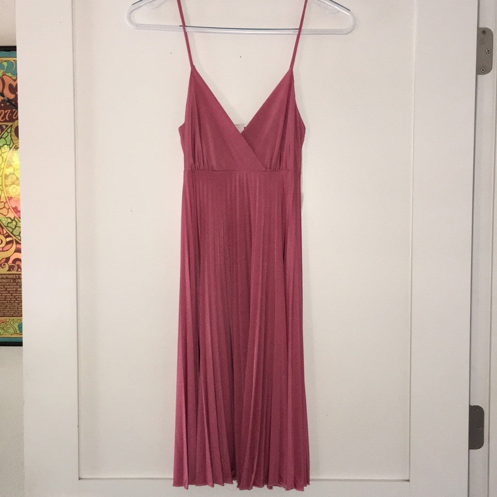 Pink dress, with spaghetti straps, v neckline.